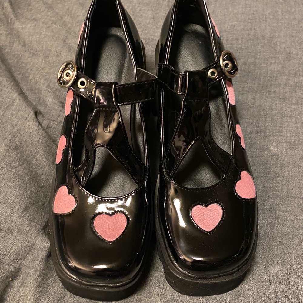 Black Mary Jane platform shoes with pink hearts